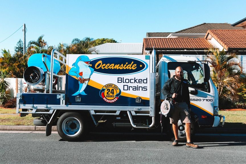 Staff Smiling in front of the Van — Reliable Local Plumbers in Gold Coast