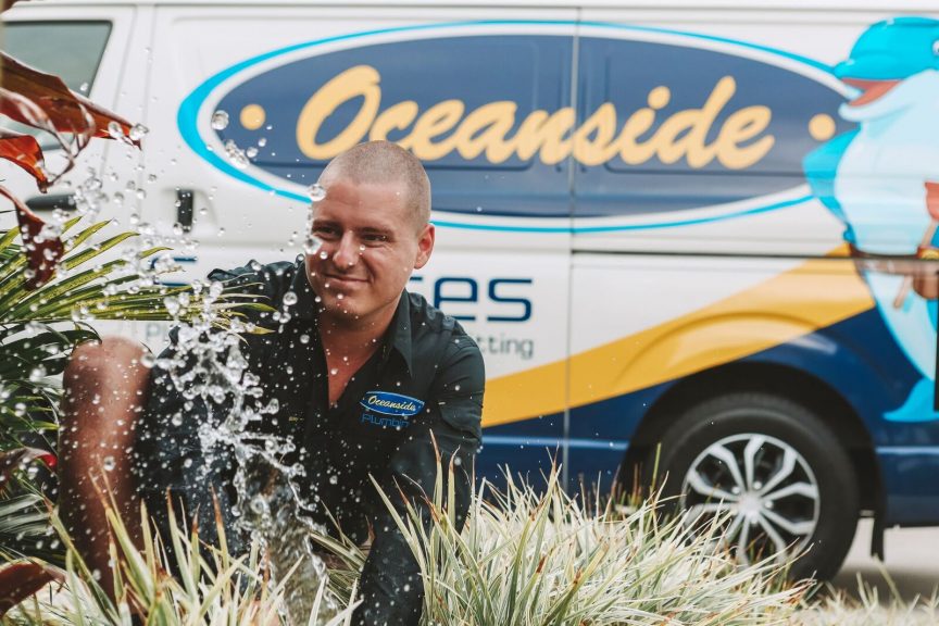 Oceanside Employee with Water Droplets — Reliable Local Plumbers in Gold Coast