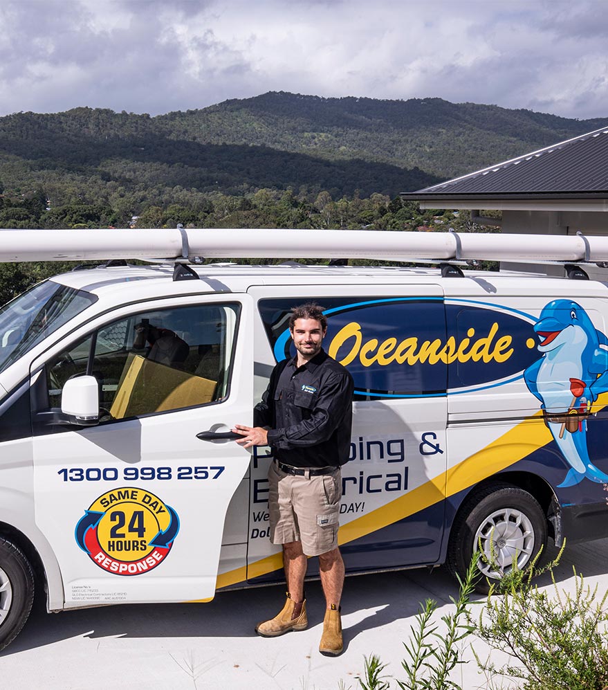 Worker Smiling Outside His Van — Reliable Local Plumbers in Gold Coast