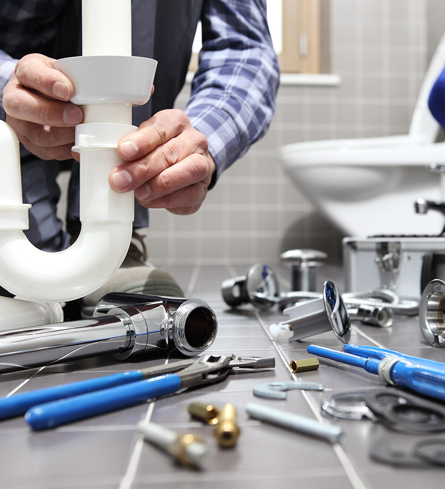 Plumber Assembling White Sink Pipe — Reliable Local Plumbers in Runaway Bay, QLD