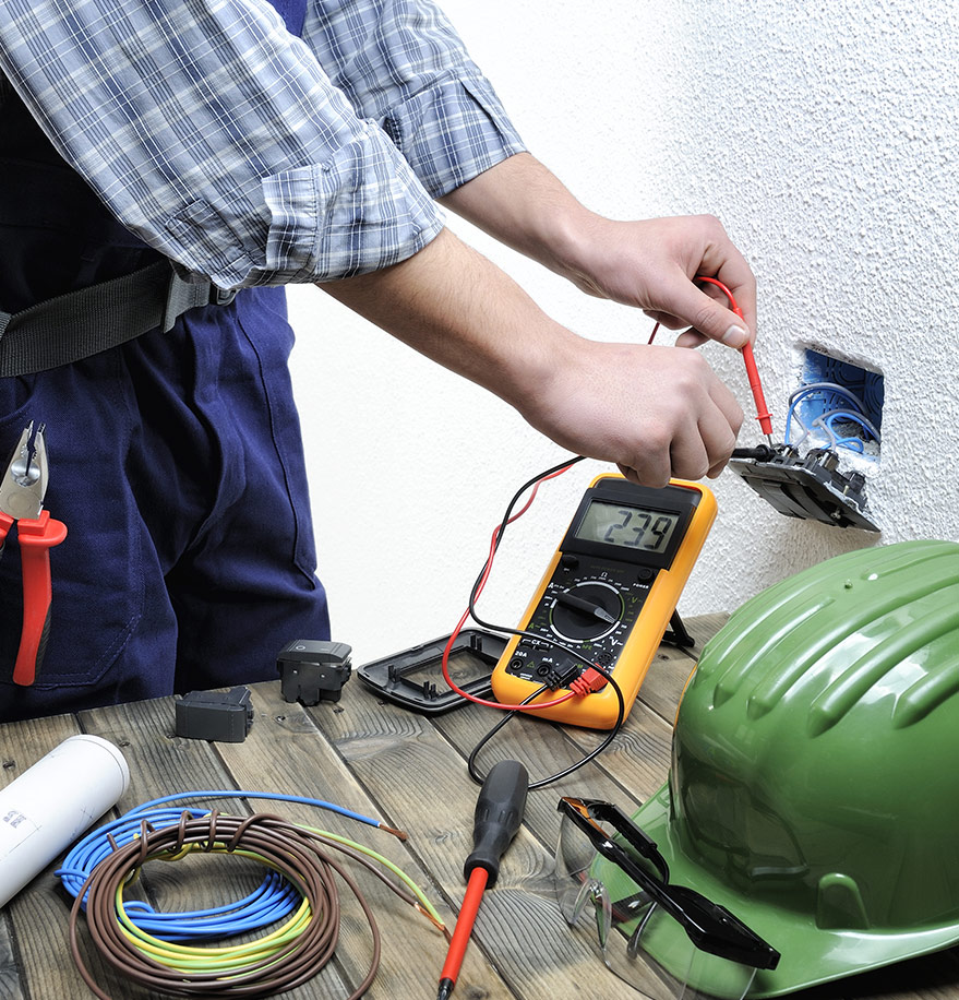 Electrician Measures the Voltage — Reliable Local Electricians in Robina, QLD