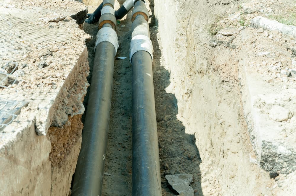 Pipe laying on soil — Reliable Local Electricians in Helensvale, QLD