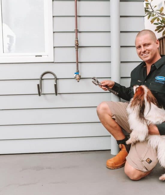 Plumber with dog — Reliable Local Electricians in Helensvale, QLD