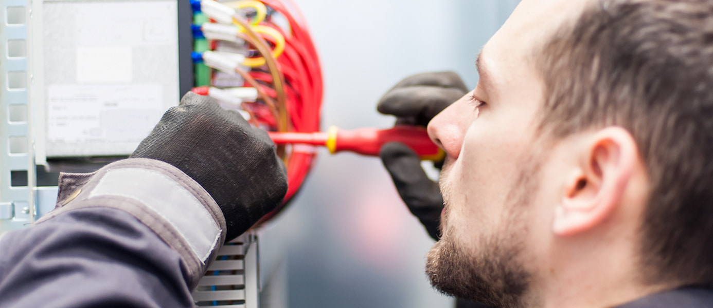 Man Repairing Electrical Cables — Reliable Local Plumbers in Helensvale, QLD