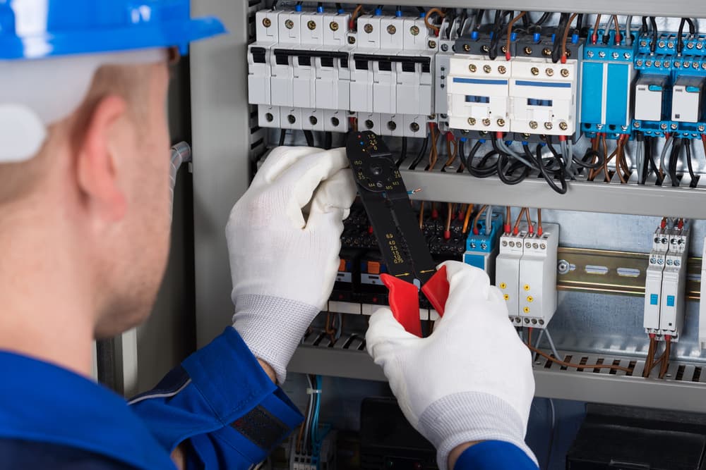 Electrician fixing electric modules — Reliable Local Electricians in Helensvale, QLD