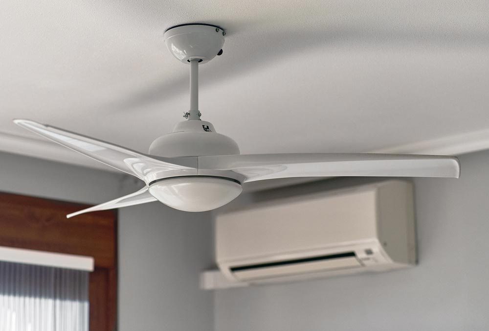 A Room With Both Air Conditioner And Ceiling Fan