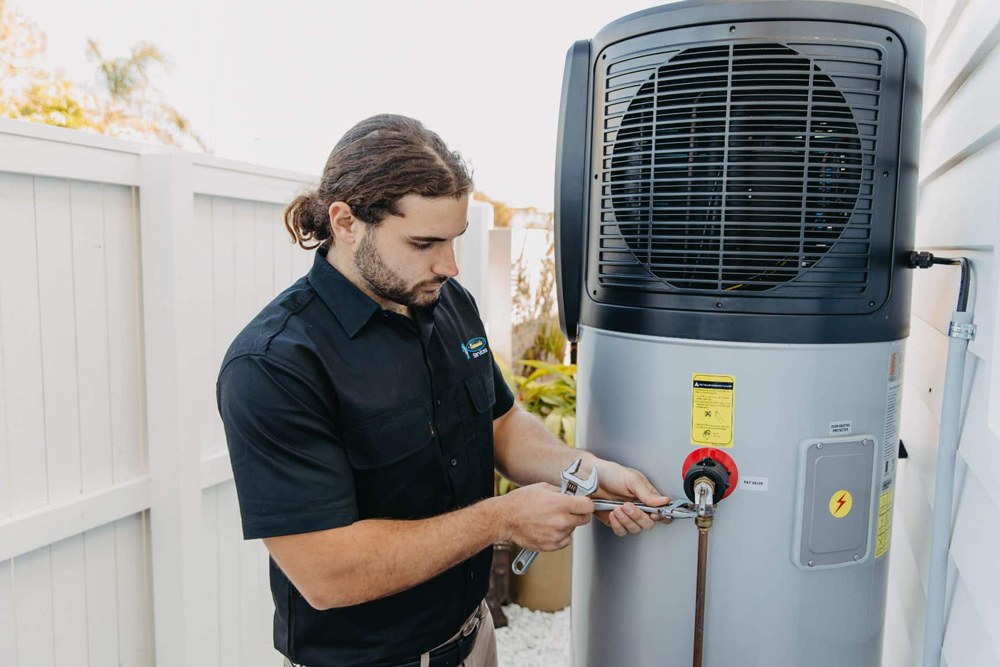 A Professional Installing A Hot Water System